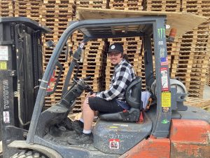 Kyle McNeal operating a forklift