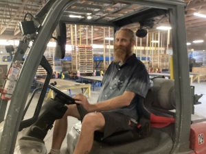 Marc Levingston operating a fork lift