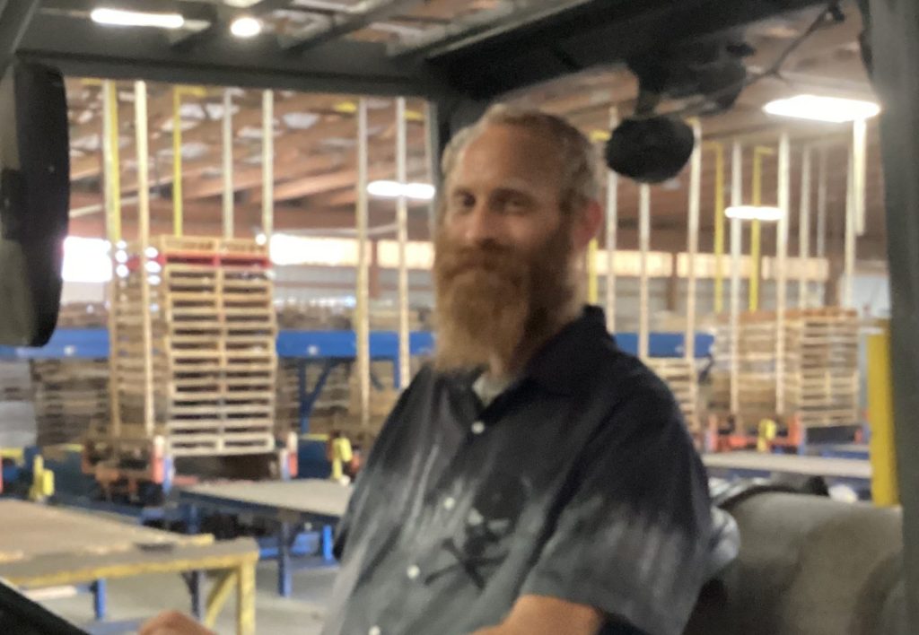 Marc Levingston operating a fork lift